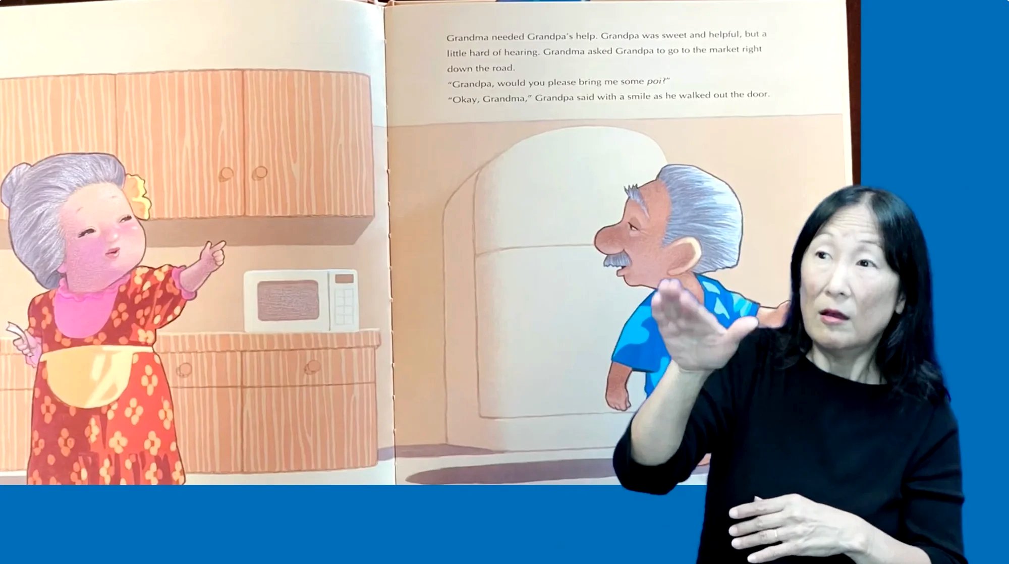 ASL interpreter signing a children's book